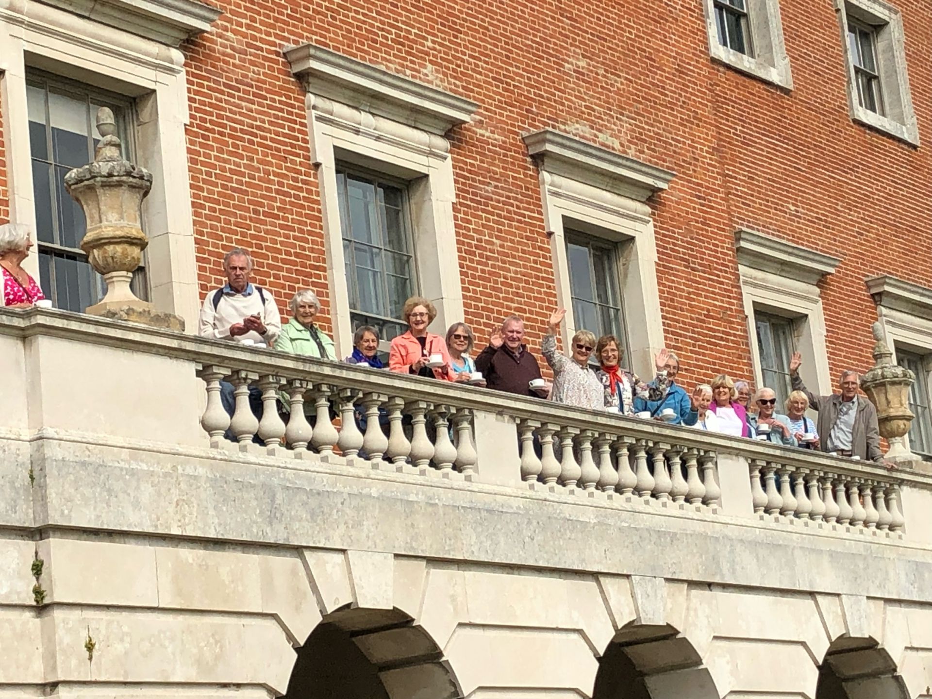 A group of people on a balcony at Wolterton Hall